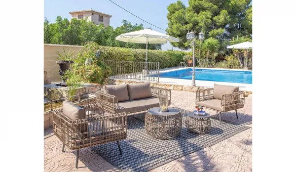 Conjunto jardín sofás de rattan y acero